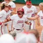 SEC softball tournament contender Alabama batter Alexis Pupillo celebrates her two-run homer in game 2 of the weekend series at Rhoads Stadium as the Crimson Tide hosted Kentucky.