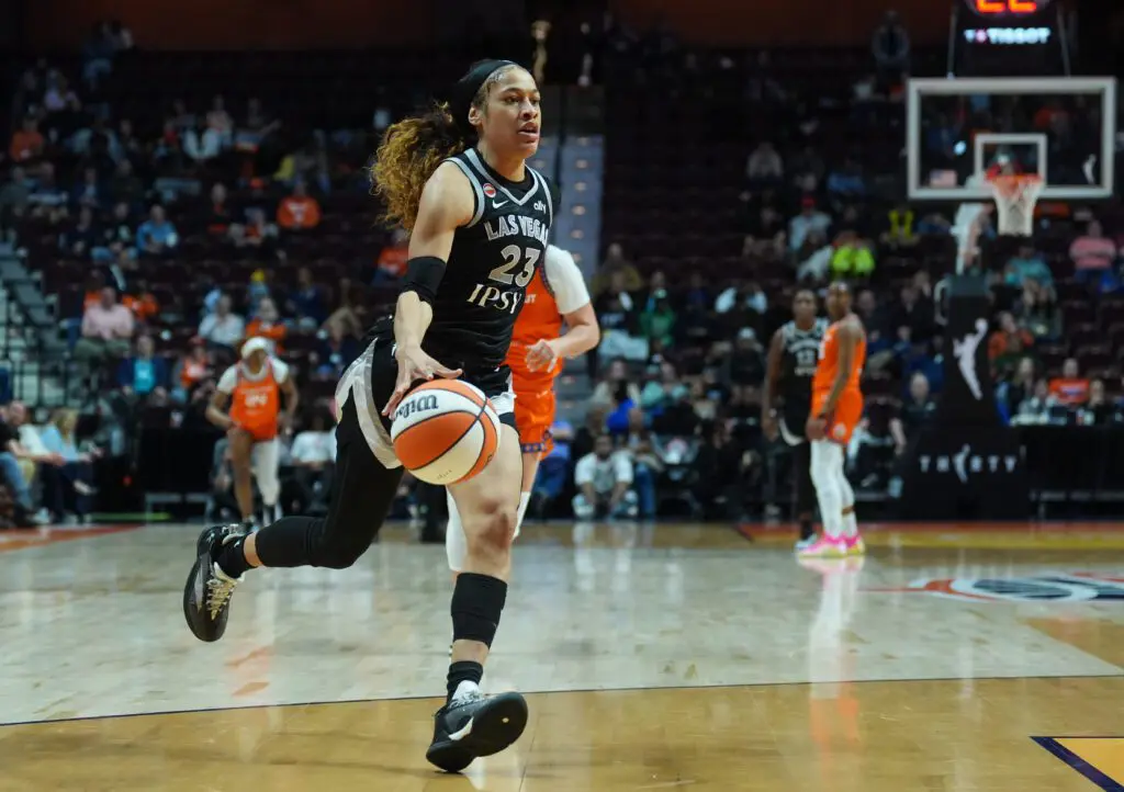 Las Vegas Aces guard Chennedy Carter (23) drives to the basket against the Connecticut Sun