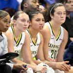 Dallas Wings guard Paige Bueckers (5) and guard Azzi Fudd (35) and forward Maddy Siegrist (20) look on from the bench during the second half against the Minnesota Lynx at College Park Center.