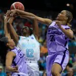 Jacksonville Waves guard Ariel Hearn (12) is guarded by Charlotte Crown guard Deja Kelly (2) and forward Lele Grissett (24) during the third quarter of an UpShot League pro women’s basketball game at VyStar Veterans Memorial Arena, Friday, May 15, 2026.