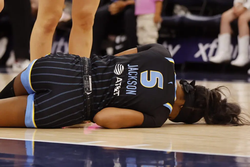Chicago Sky forward Rickea Jackson (5) lays on the floor after an injury against the Minnesota Lynx in the second quarter at Target Center.
