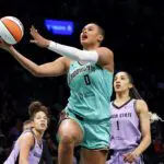 New York Liberty forward Satou Sabally (0) drives to the basket against Golden State Valkyries forward Gabby Williams (1) during the second half at Barclays Center.