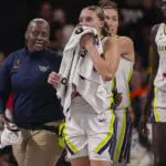 Dallas Wings guard Paige Bueckers (5) is assisted after falling and being injured against the Atlanta Dream.