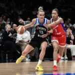 New York Liberty forward Leonie Fiebich (13) tries to drive past Phoenix Mercury forward Noemie Brochant (1) during the first half at Barclays Center.