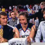 Early WNBA ESPN commentators Geno Auriemma and Robin Roberts speak to Rebecca Lobo #50 of the New York Liberty after the game against the Charlotte Sting on July 10, 1997 at Madison Square Garden in New York, New York.