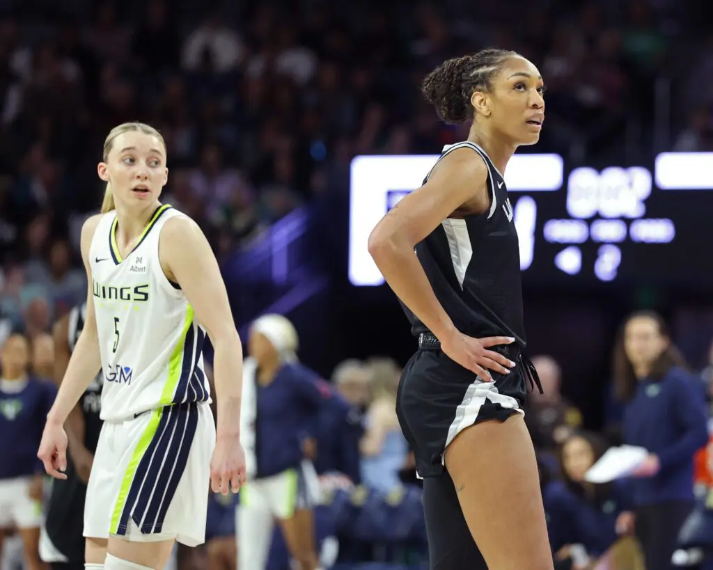 A'ja Wilson #22 of the Las Vegas Aces and Paige Bueckers #5 of the Dallas Wings look on during the game during the WNBA Preseason Game.