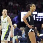 A'ja Wilson #22 of the Las Vegas Aces and Paige Bueckers #5 of the Dallas Wings look on during the game during the WNBA Preseason Game.