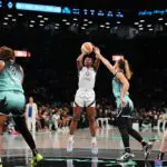 Jackie Young #0 of the Las Vegas Aces shoots the ball during the game against the New York Liberty during a WNBA game on July 8, 2025 at Barclays Center Arena in Brooklyn, New York ahead of tonight's Aces vs Liberty game.