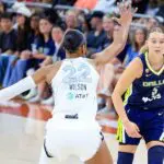 Dallas Wings guard Paige Bueckers #5 dribbles past Las Vegas Aces center A'ja Wilson #22 during the game on May 03, 2026, at the Moody Center in Austin, TX.