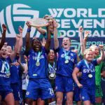 W7F winner Kadeisha Buchanan of Chelsea lifts the World Sevens Football trophy during the World Sevens Football awards after the team's victory in the Final match between Chelsea and Manchester United on Day Three of the World Sevens Football at Gtech Community Stadium on May 30, 2026 in Brentford, England.