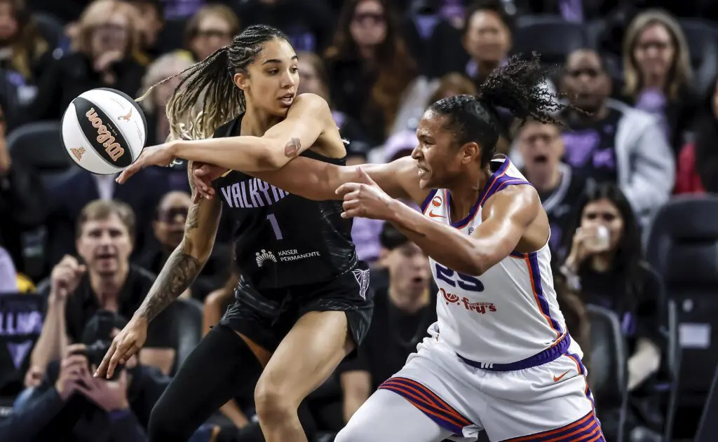 Gabby Williams (1) and Alyssa Thomas (25) battle for a loose ball in the second half as the Golden State Valkyries played the Phoenix Mercury at Chase Center.