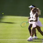Serena Williams and Victoria Mboko compete during their round of 16 doubles match at The HSBC Championships 2026 women's tennis tournament at The Queen's Club in London, England