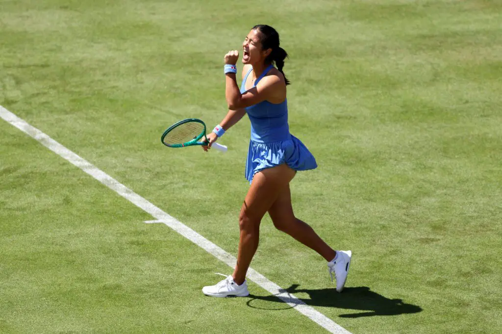 Emma Raducanu of Great Britain celebrates winning match point against Anna Blinkova during the Women's Singles first round match on Day Two of the HSBC Championships at The Queen's Club.
