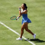 Emma Raducanu of Great Britain celebrates winning match point against Anna Blinkova during the Women's Singles first round match on Day Two of the HSBC Championships at The Queen's Club.