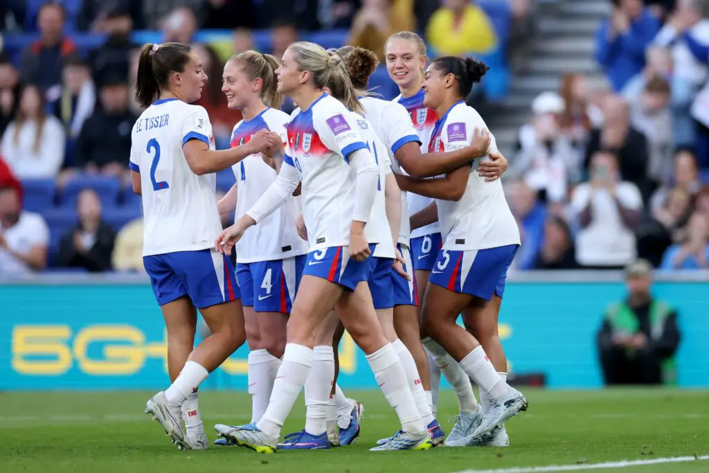 Jess Carter of England celebrates scoring her team's first goal with teammates during the FIFA Women's World Cup 2027 Qualifier match between England and Ukraine.