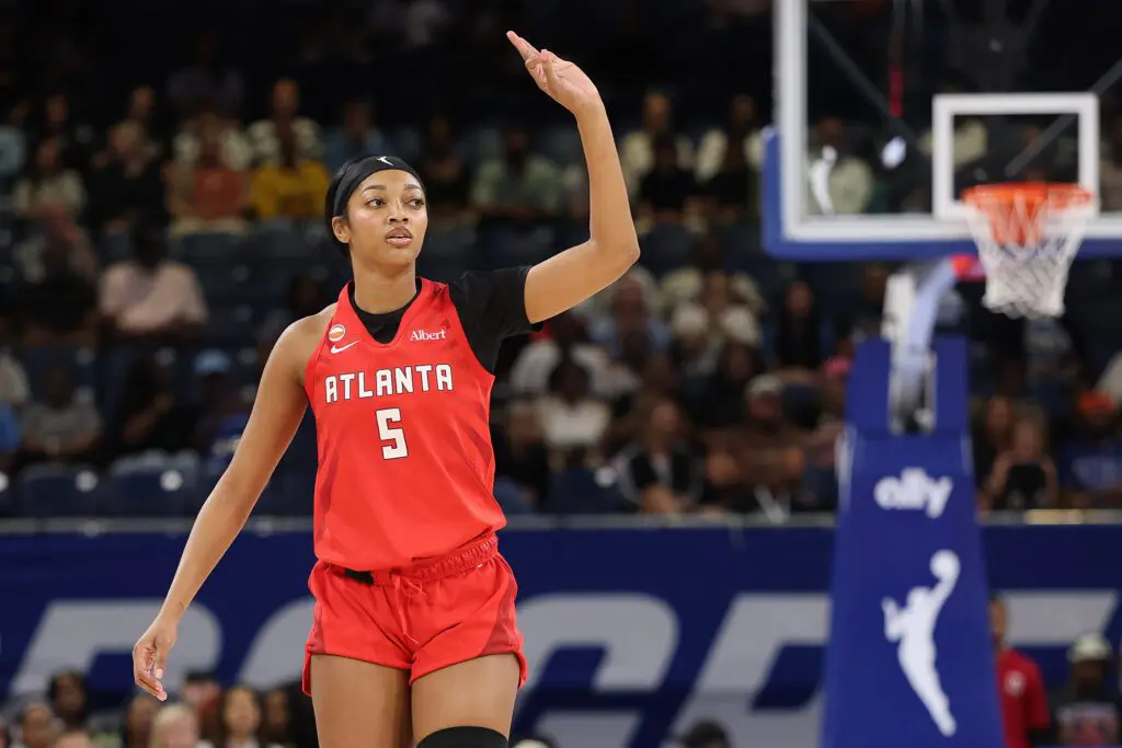 Angel Reese #5 of the Atlanta Dream celebrates a three pointer against the Chicago Sky during the first half at Wintrust Arena.