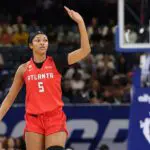 Angel Reese #5 of the Atlanta Dream celebrates a three pointer against the Chicago Sky during the first half at Wintrust Arena.