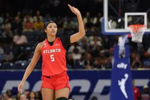 Angel Reese #5 of the Atlanta Dream celebrates a three pointer against the Chicago Sky during the first half at Wintrust Arena.