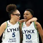Olivia Miles #5 and Courtney Williams #10 of the Minnesota Lynx celebrate against the Dallas Wings in the second quarter at Target Center on June 09, 2026 in Minneapolis, Minnesota ahead of the Lynx vs Aces WNBA Commissioner's Cup game.