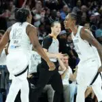 Chelsea Gray #12 and Jewell Loyd #24 of the Las Vegas Aces celebrate after Gray got a rebound and then drew a foul against the Minnesota Lynx late in the fourth quarter of their game at Michelob ULTRA Arena on June 13, 2026 in Las Vegas, Nevada. The Aces defeated the Lynx 100-97.