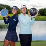 Yana Wilson and Gina Kim of the United States pose with the winner's trophy after winning the Dow Championship 2026 at Midland Country Club on June 14, 2026 in Midland, Michigan.
