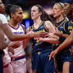 Alyssa Thomas #25 of the Phoenix Mercury and Caitlin Clark #22 of the Indiana Fever get into a scuffle during the game at Gainbridge Fieldhouse on June 22, 2026 in Indianapolis, Indiana in the Fever vs Mercury WNBA game.