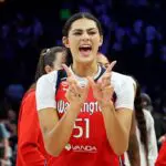 Lauren Betts #51 of the Washington Mystics celebrates the win against the Minnesota Lynx after the game at Target Center on June 21, 2026 in Minneapolis, Minnesota. The Mystics defeated the Lynx 84-79.