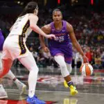Phoenix Mercury forward Alyssa Thomas (25) drives towards the basket while defended by Indiana Fever guard Caitlin Clark (22) in the first half of play during a WNBA game between the Phoenix Mercury and the Indiana Fever on June 24, 2026 at Gainbridge Fieldhouse in Indianapolis.