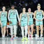 Breanna Stewart #30, Jonquel Jones #35, Sabrina Ionescu #20, Pauline Astier #18 and Leonie Fiebich #13 of the New York Liberty walk back on the court after a timeout in the second quarter of their game against the Las Vegas Aces.