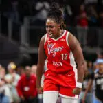 Las Vegas Aces guard Chelsea Gray (12) reacts after making a go-ahead basket.