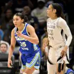 Dallas Wings guard Azzi Fudd (35) celebrates as Las Vegas Aces guard Chennedy Carter (23) looks on during the second half at College Park Center.