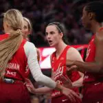Indiana Fever guard Caitlin Clark (22) talks with guard Sophie Cunningham (8), guard Lexie Hull (10), and Indiana Fever during a game against the Golden State Valkyries in the fourth quarter at Chase Center ahead of the Fever vs Dream WNBA game.
