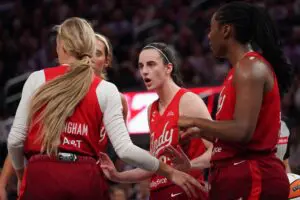 Indiana Fever guard Caitlin Clark (22) talks with guard Sophie Cunningham (8), guard Lexie Hull (10), and Indiana Fever during a game against the Golden State Valkyries in the fourth quarter at Chase Center ahead of the Fever vs Dream WNBA game.