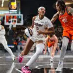Atlanta Dream forward Angel Reese (5) drives on Connecticut Sun center Brittney Griner (42) in the second quarter at Gateway Center Arena.