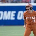 Texas Longhorns utility Reese Atwood (14) reacts at second base after hitting a double in the fourth inning against the Texas Tech Red Raiders during Game Two of the NCAA WomenÕs College World Series championship series at Devon Park.