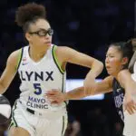Minnesota Lynx guard Olivia Miles (5) drives with the ball against Golden State Valkyries guard Kaitlyn Chen (2) in the third quarter at Target Center.