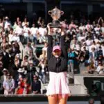 Mirra Andreeva lifts the trophy after winning the women’s singles final against Maja Chwalinska of Poland at Stade Roland Garros.