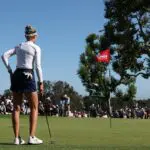 Nelly Korda stands on the 18th green during the final round of the U.S. Women's Open golf tournament at Riviera Country Club, topping the LPGA leaderboard ahead of the 2026 KPMG Women's PGA Championship.