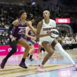 Atlanta Dream forward Angel Reese (5) dribbles against Toronto Tempo forward Isabelle Harrison (21) during the first half at Coca-Cola Coliseum.