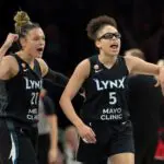 Minnesota Lynx guard Olivia Miles (5) celebrates with guard Kayla McBride (21) after making a shot against the Portland Fire in the second half at Target Center.