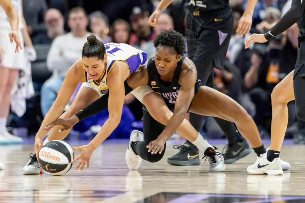 Los Angeles Sparks guard Kelsey Plum (10) and Golden State Valkyries guard-forward Kaila Charles (6) fight for the ball during the fourth quarter in a Commissioner’s Cup game at Chase Center.