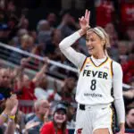 Indiana Fever guard Sophie Cunningham (8) celebrates a made shot in the first half against the Toronto Tempo.