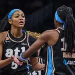Atlanta Dream forward Angel Reese (5) high fives teammate guard Rhyne Howard (10) during the game against the Indiana Fever during the fourth quarter at State Farm Arena ahead of tonight's Dream vs Tempo WNBA game.