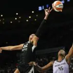 Las Vegas Aces center A'ja Wilson (22) reaches for the ball against Golden State Valkyries center Nadia Fingall (45) during the fourth quarter of a WNBA basketball game at Michelob Ultra Arena during the valkyries vs aces WNBA game.