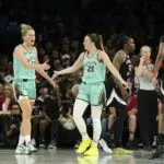 New York Liberty guard Sabrina Ionescu (20) celebrates with forward Leonie Fiebich (13) after scoring against the Las Vegas Aces during the second quarter of a WNBA basketball game at Michelob Ultra Arena.