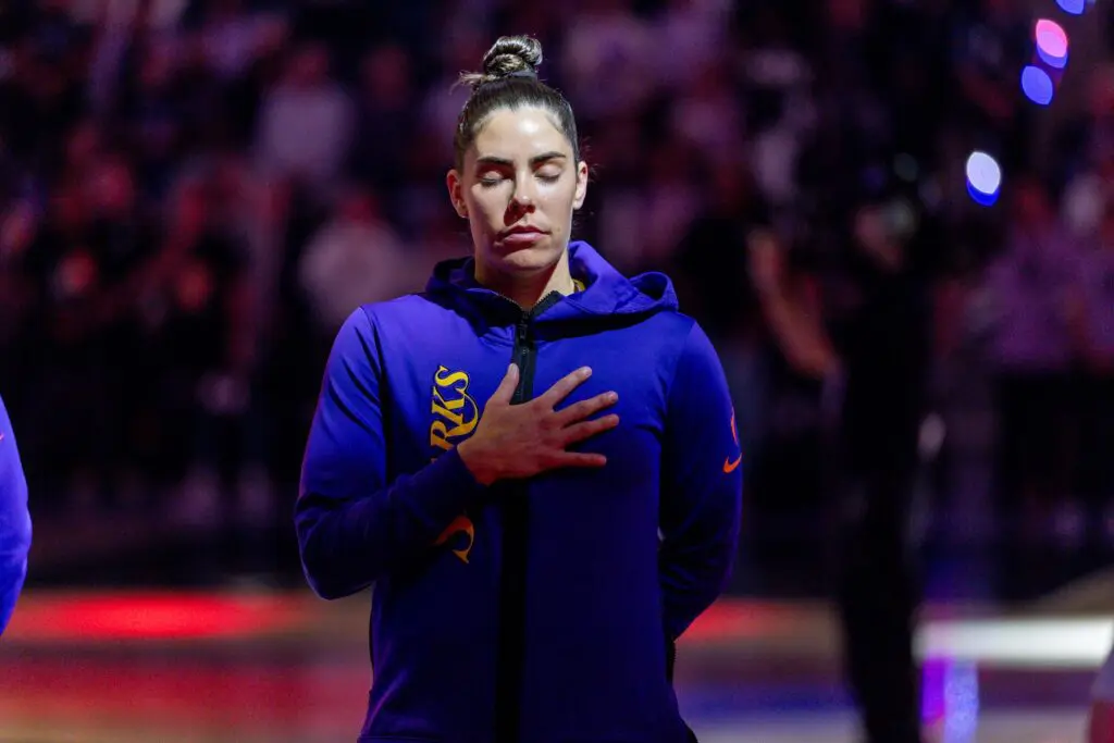 Los Angeles Sparks guard Kelsey Plum (10) listens to the National Anthem before the game against the Golden State Valkyries in a Commissioner’s Cup game at Chase Center.