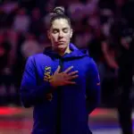 Los Angeles Sparks guard Kelsey Plum (10) listens to the National Anthem before the game against the Golden State Valkyries in a Commissioner’s Cup game at Chase Center.