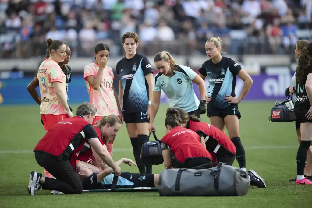 Jul 24, 2026; Portland, Oregon, USA; Gotham FC defender Emily Sonnett (6) is attended to during the first half in a game against Portland Thorns FC at Providence Park.