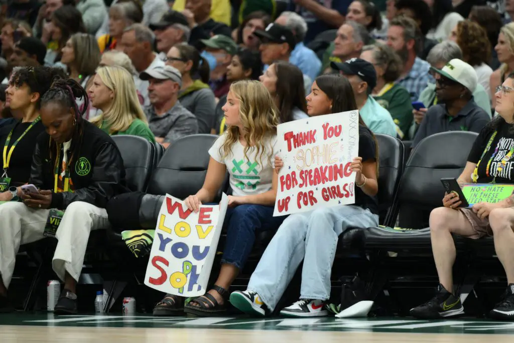Fans hold a Indiana Fever guard Sophie Cunningham (8) (not pictured) sign during the first half between the Seattle Storm and the Indiana Fever at Climate Pledge Arena.