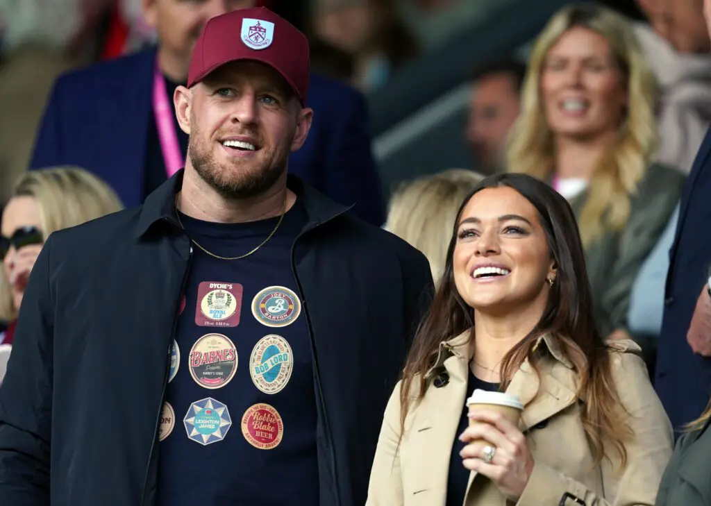 Burnley minority share holders JJ Watt and Kealia Watt applaud from the stands during the Sky Bet Championship match at Turf Moor, Burnley.